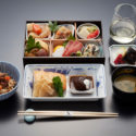 a tray of food and chopsticks