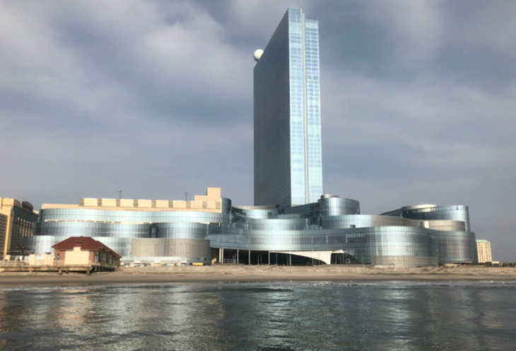 a building next to a body of water