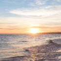 a sunset over a beach