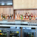 a bar with bottles and glasses