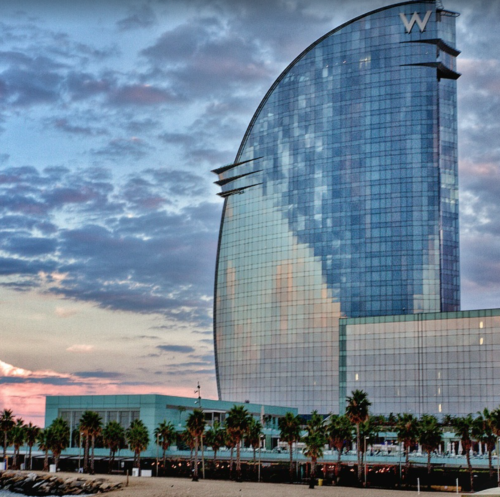 a building with a curved glass surface