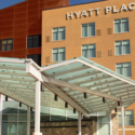 a glass covered entrance to a hotel