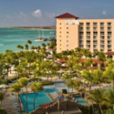 a hotel with a pool and palm trees