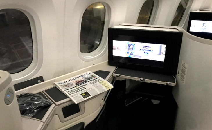 a tv on a table in an airplane