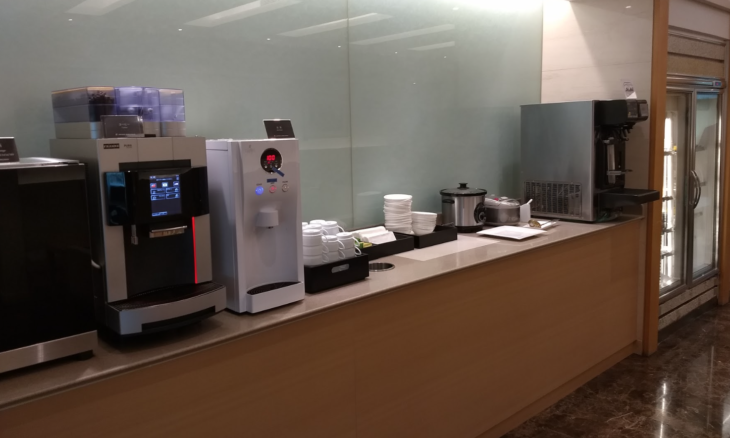 a coffee machine and coffee maker on a counter