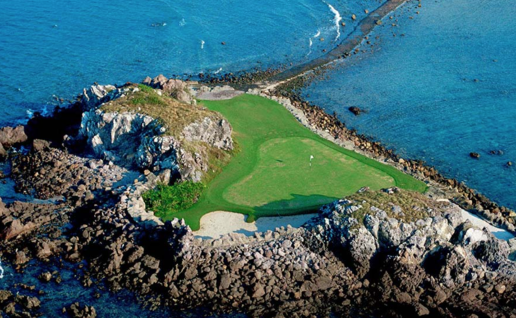a golf course on a rocky island