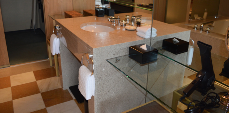 a bathroom with a glass countertop