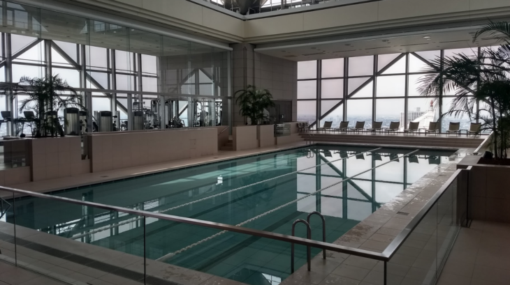 a indoor swimming pool with a large window