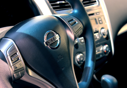 close-up of a steering wheel and dashboard of a car