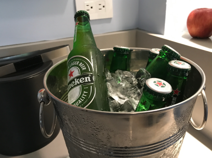 a bucket of beer bottles and ice