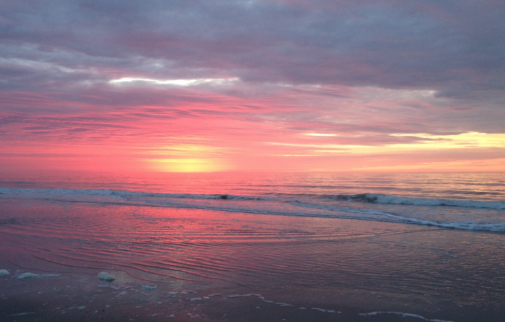 a sunset over a beach