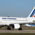 a white airplane on a runway