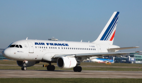 a white airplane on a runway