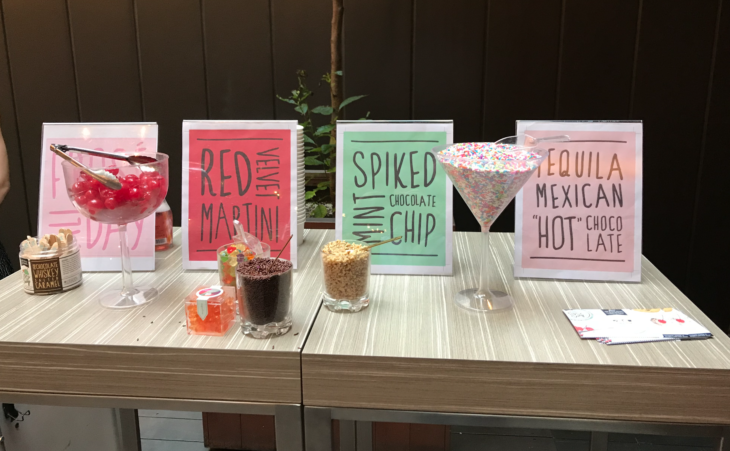 a table with different drinks and signs