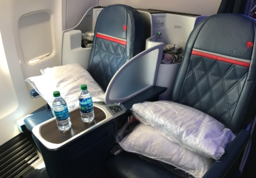 a seat with two bottles of water on the side