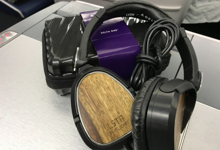 a black headphones with a wooden design on it