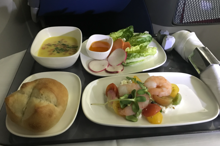 a tray of food on a plane