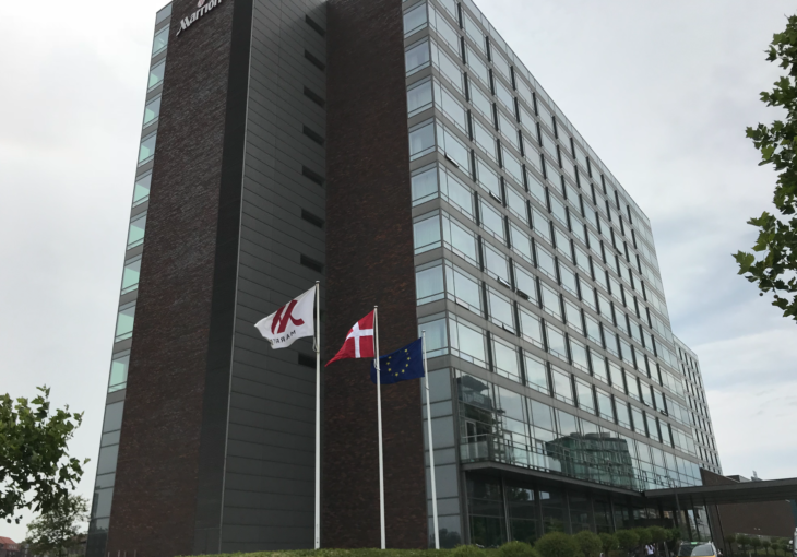 a building with flags in front of it