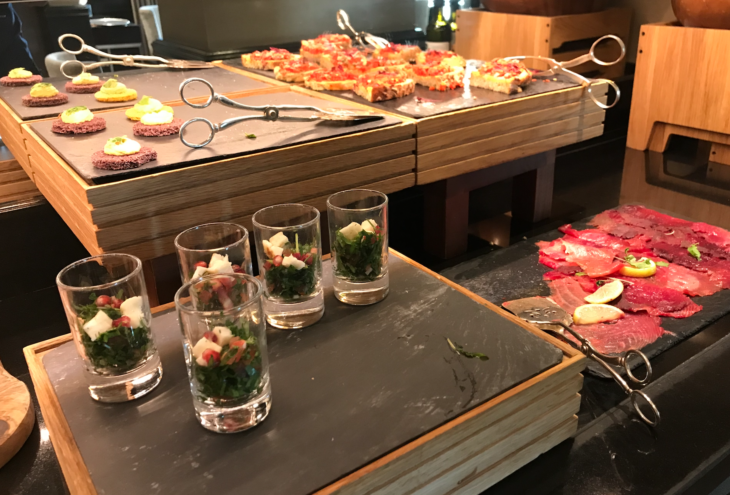 a group of glasses with food on a table