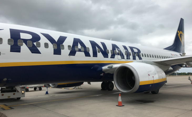 a large airplane with blue and white text on it