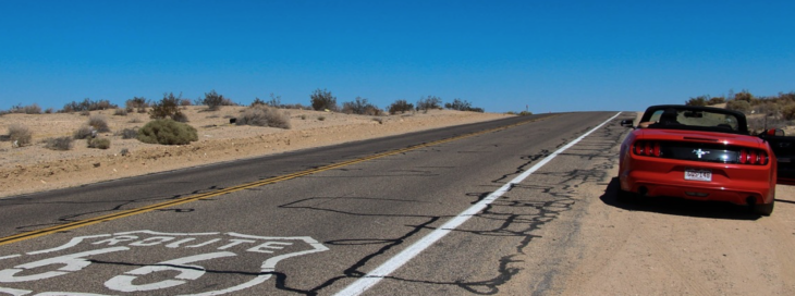 a road with a sign painted on it