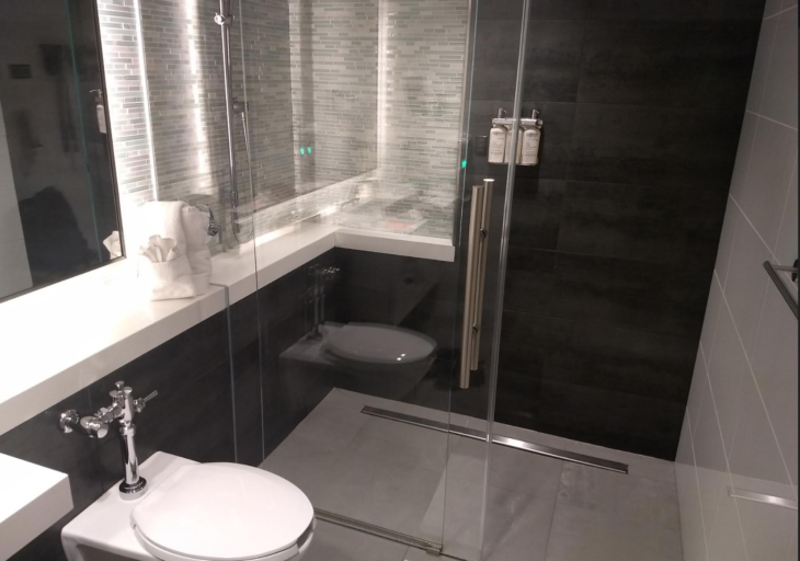 a bathroom with a glass shower door