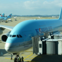 a large blue airplane at an airport