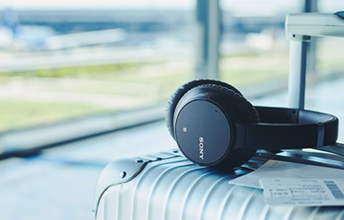 a black headphones on a silver suitcase