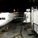 a plane on the runway at night