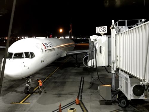 a plane on the runway at night