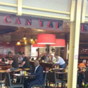 people sitting at tables in a restaurant