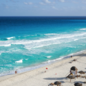 a beach with umbrellas and umbrellas