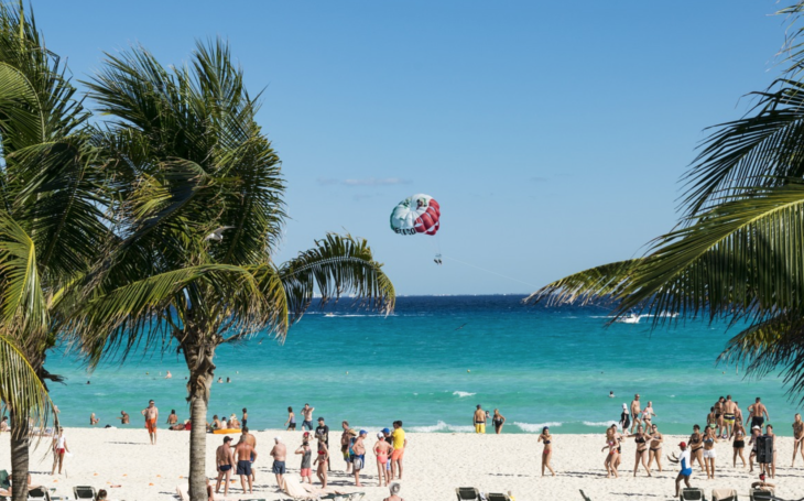 a group of people on a beach