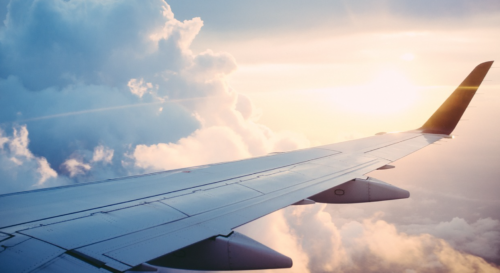 the wing of an airplane in the sky