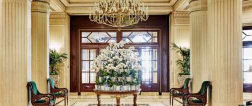 a large chandelier in front of a large glass door