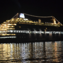 a large ship in the water at night