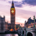 Big Ben over a river with a clock tower