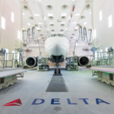 a white airplane in a hangar