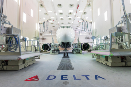 a white airplane in a hangar