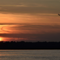 a plane flying over water