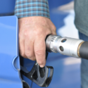 a hand holding a gas pump