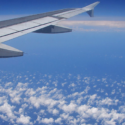 an airplane wing above clouds