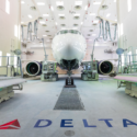 a white airplane in a hangar