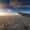 an airplane wing above clouds