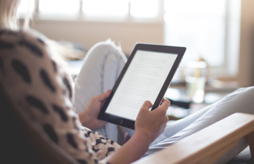 a woman holding a tablet