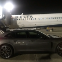 a car parked next to a plane