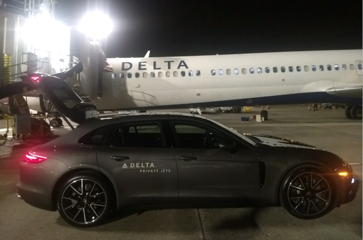 a car parked next to a plane