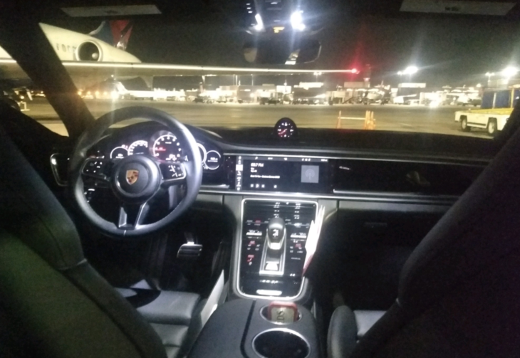 inside a car with a steering wheel and dashboard