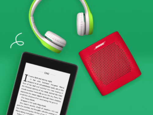 a tablet and headphones on a green surface