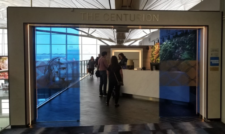 people standing in front of a reception desk